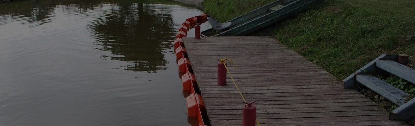 Silt boom along waterside dock