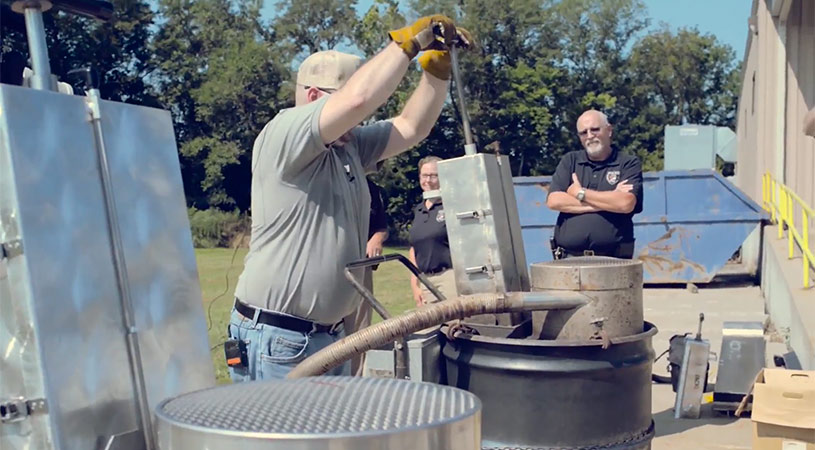 man using incinerator